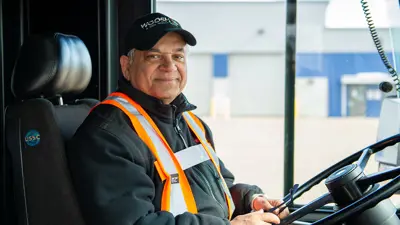 Bus driver smiling at camera